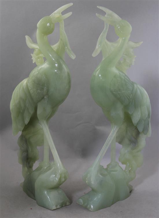 A pair of large Chinese bowenite jade figures of cranes, 20th century, 36.5cm